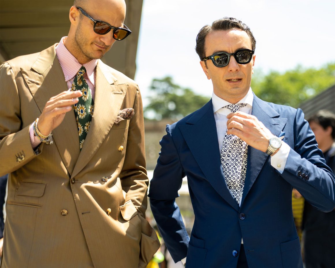 The well dressed men in suits wearing sunglasses during Pitti Uomo in Florence