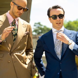 The well dressed men in suits wearing sunglasses during Pitti Uomo in Florence