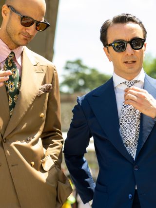 The well dressed men in suits wearing sunglasses during Pitti Uomo in Florence