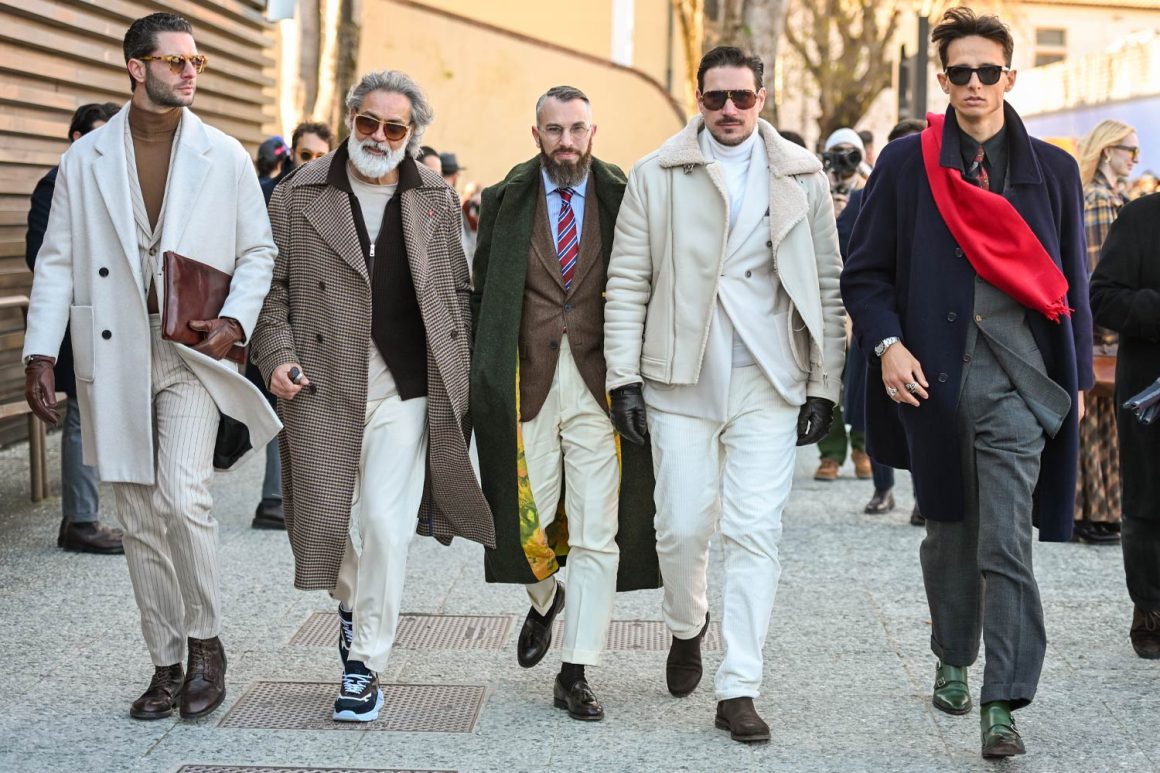 A group of 5 men showing their best looks During Pitti Uomo 107.