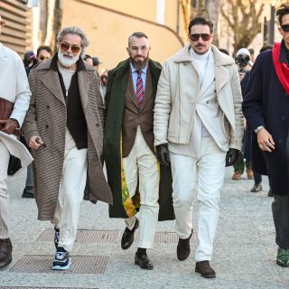 A group of 5 men showing their best looks During Pitti Uomo 107.