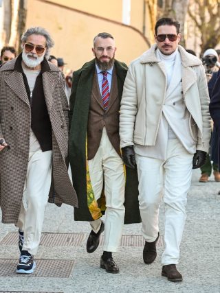 A group of 5 men showing their best looks During Pitti Uomo 107.