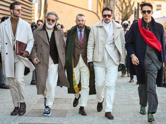A group of 5 men showing their best looks During Pitti Uomo 107.