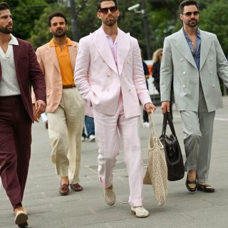 4 stylish men walking the streets of Florence during Pitti Uomo