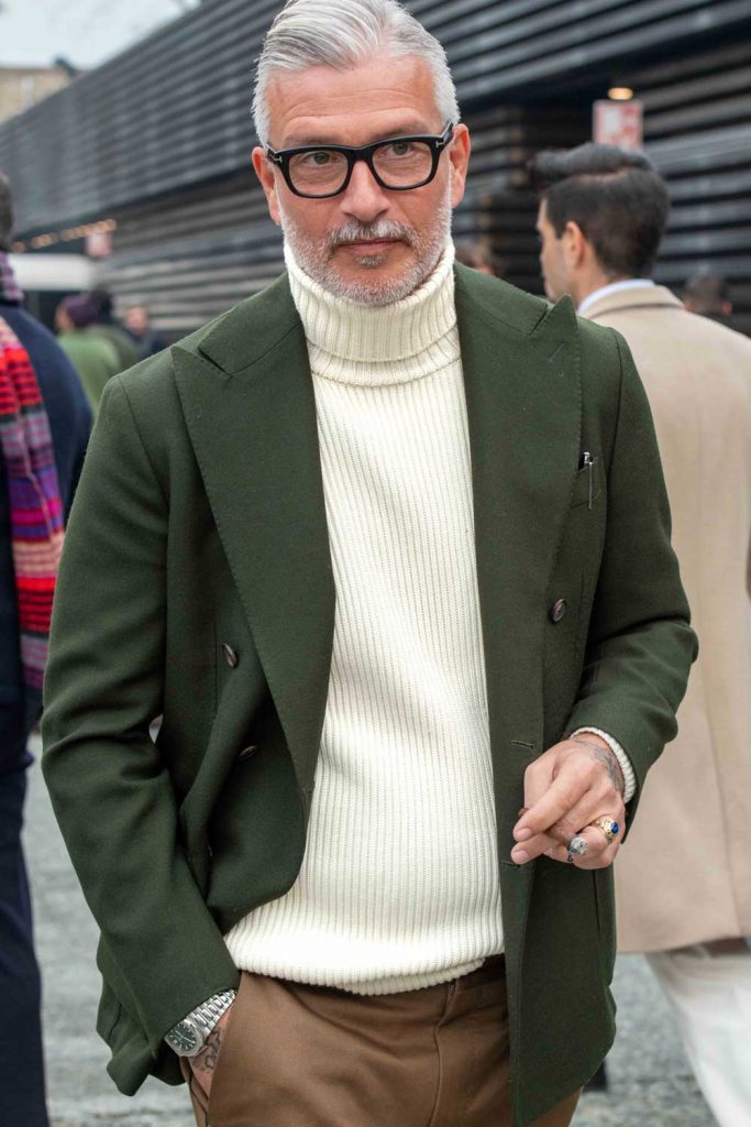 Turtleneck knitwear under a green sports jacket